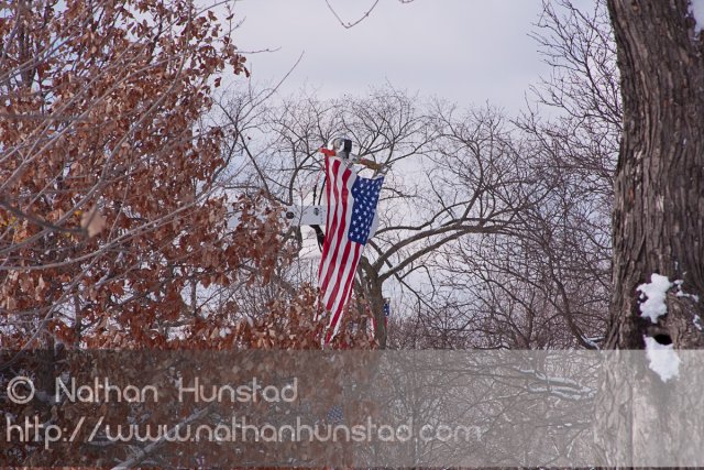 A flag hangs from a cherry picker